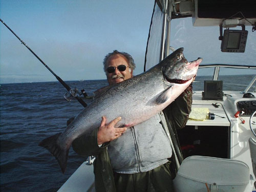butch holding a large salmon